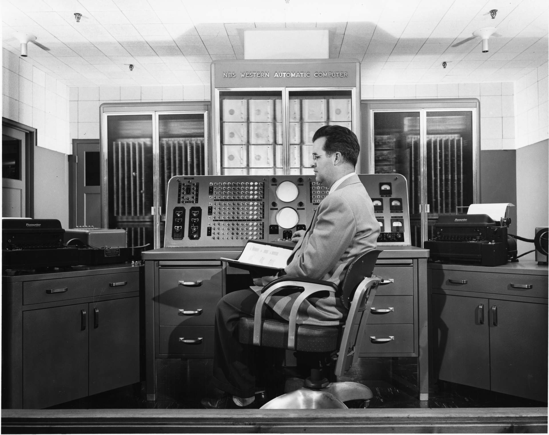 old picture of person in 1950's computer room