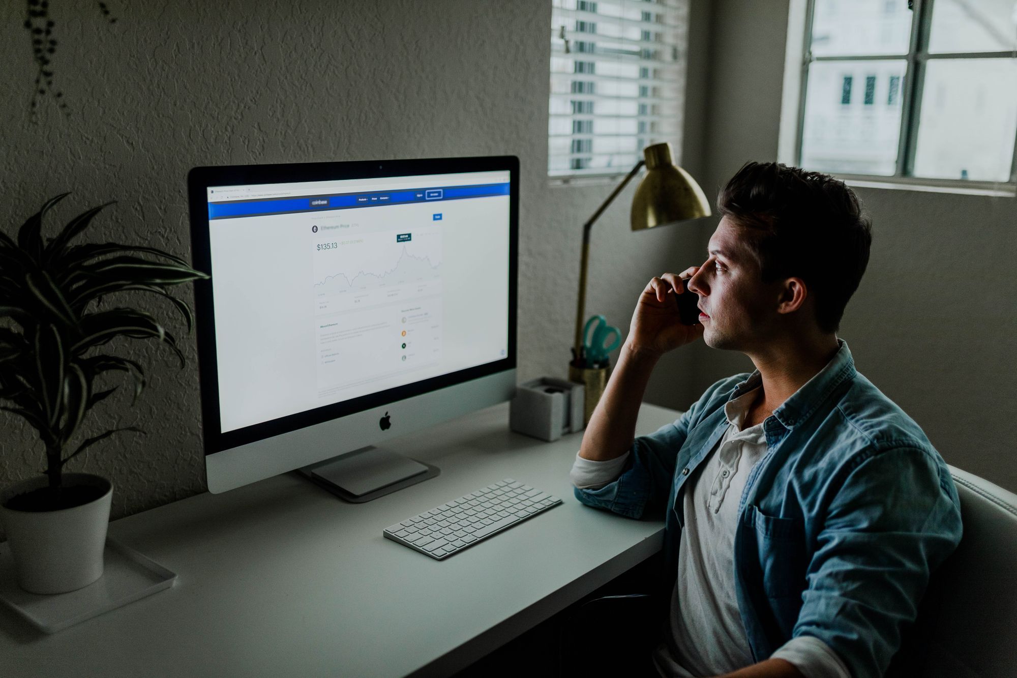 man watching screen with saas metrics